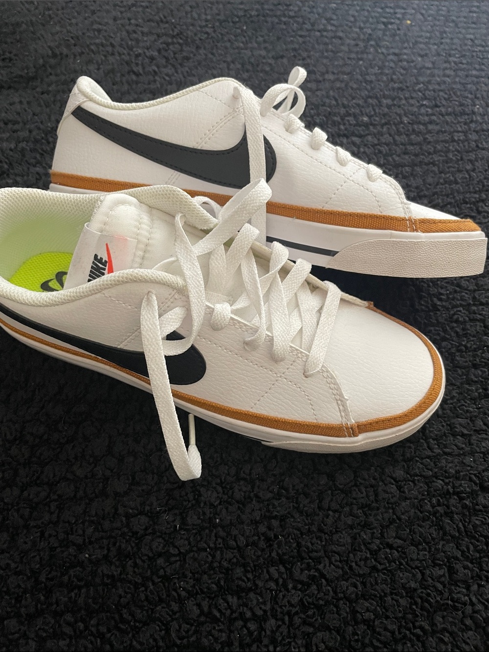 Nike White Low-Top Sneakers with Black Swoosh and Brown Trim